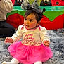 toddler, child, baby, pink_tutu, white_tights, headband, spiderweb_bow, indoor, play_area, ladybug, colorful, rug, floor, cute, smiling, sitting, portrait, young_child, festive, fun