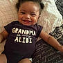 Talia joined the competition — help win amazing prizes! baby, infant, smiling, dimples, clothing, onesie, text, bed, pillow, blanket, happy, cute, lying_down, person, face, hair, skin, indoors, child, toddler