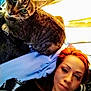 Kitty joined the competition — help win amazing prizes! cat, tabby_cat, person, red_hair, indoors, close_up, face, pet, animal, companion, relaxed, cozy, soft_fabric, curious, feline, portrait, casual, resting, domestic, bond