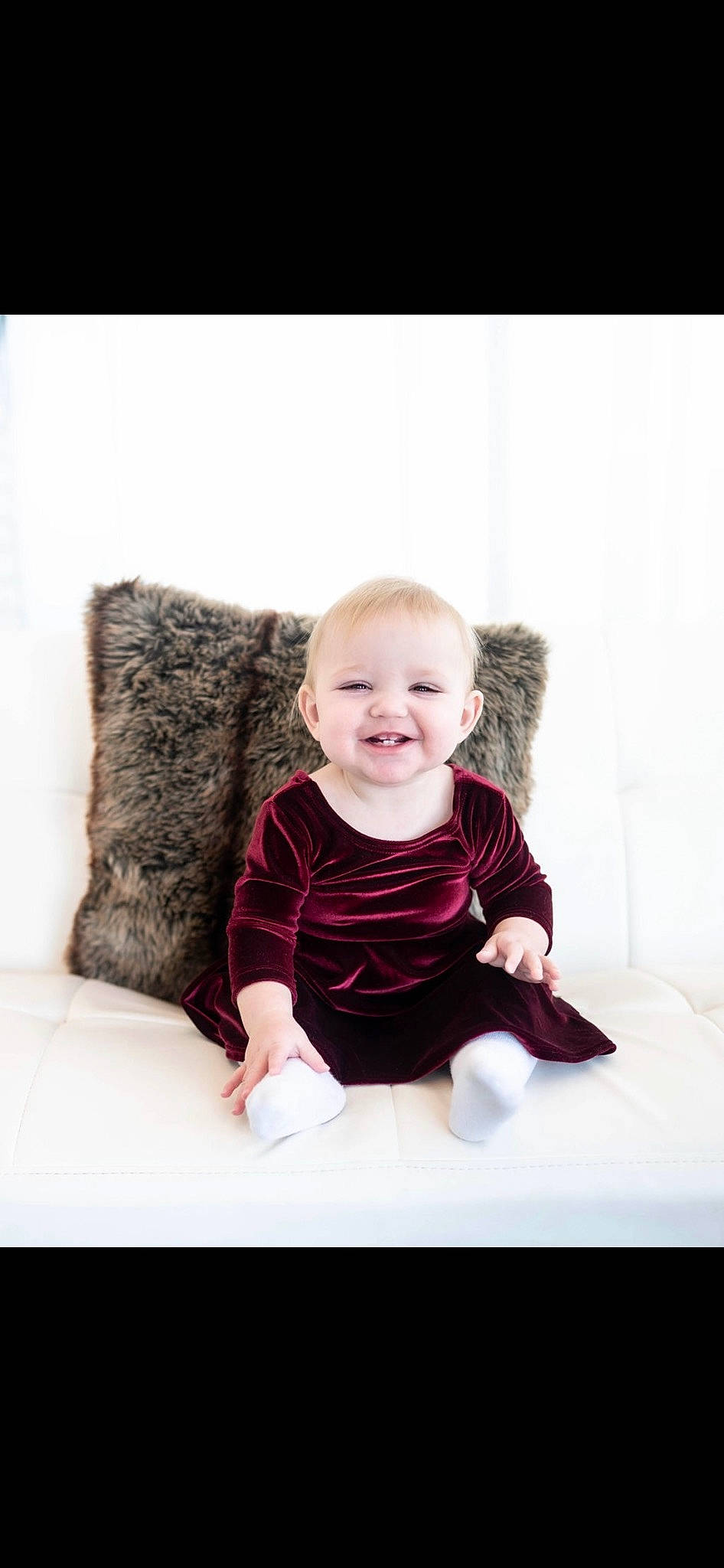 Ellie joined the competition — help win amazing prizes! baby, baby_toddler_clothing, comfort, couch, flash_photography, floor, flooring, fun, gesture, happy, human_body, joy, neck, pattern, person, shoulder, skin, sleeve, smile, t_shirt