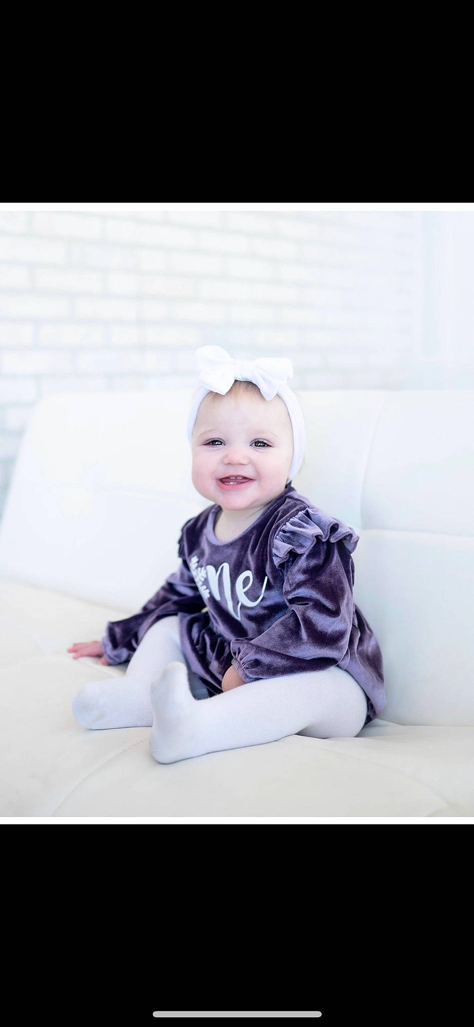 Ellie is registered to the contest to win money with this photo: baby, baby_toddler_clothing, child, collar, comfort, face, fashion_accessory, flash_photography, happy, head, joy, pattern, person, portrait, portrait_photography, room, sitting, sleeve, smile, stock_photography