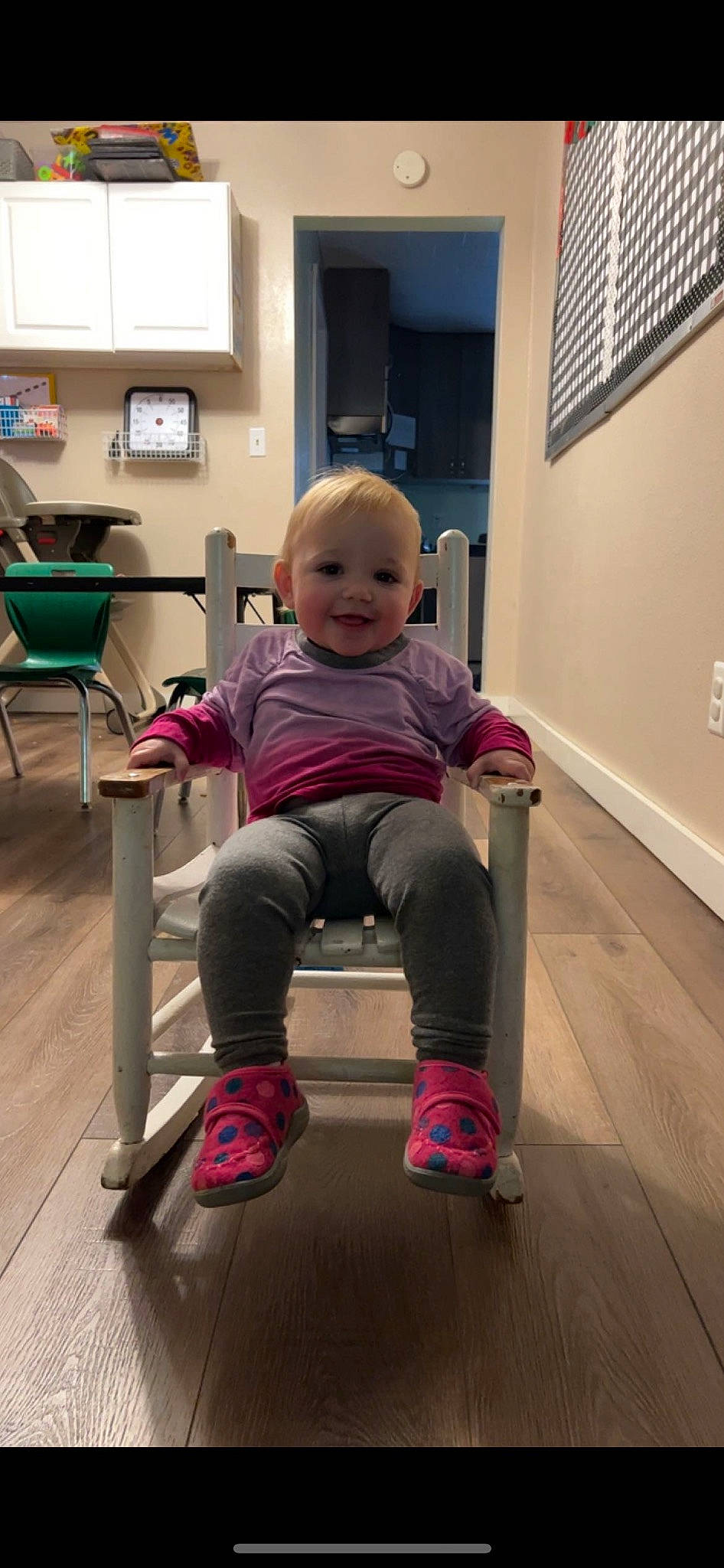 Ellie joined the competition — help win amazing prizes! baby, baby_toddler_clothing, chair, child, cleanliness, comfort, eye, floor, flooring, fun, human_leg, joy, knee, person, shoe, shorts, sitting, smile, sneakers, standing