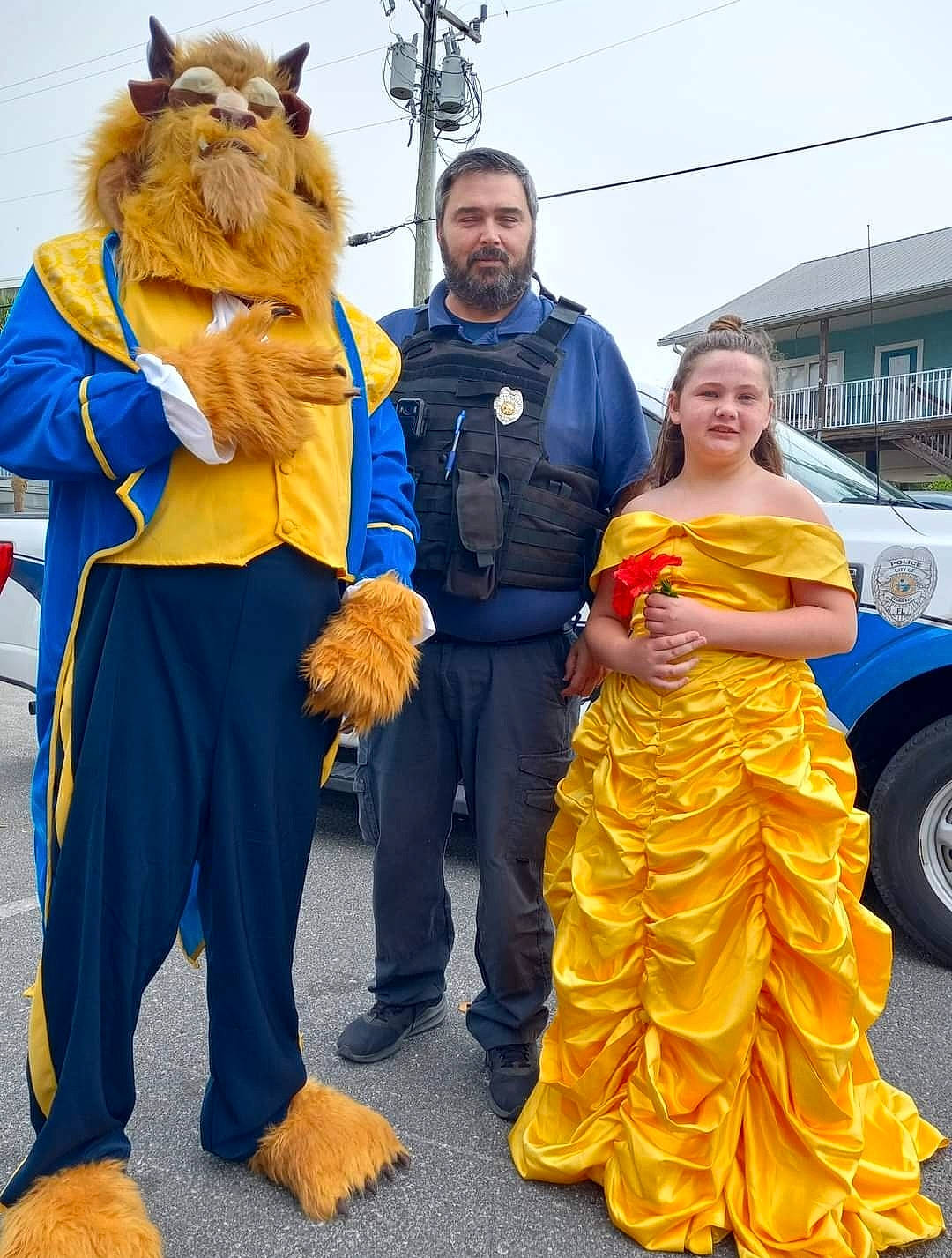 Marianna is registered to the contest to win money with this photo: car, costume, event, festival, fictional_character, formal_wear, fun, fur, gown, happy, hat, joy, motor_vehicle, person, public_event, recreation, sky, smile, tire, tradition