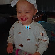 Oceanna joined the competition — help win amazing prizes! bottle, bow, casual, child, clothing, cute, face, happy, headband, holding, indoor, jeans, mushroom_pattern, person, portrait, smile, standing, sweater, toddler, young_child