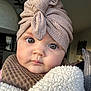 baby, beanie, bonnet, cap, clothing, coat, face, hat, head, hood, hoodie, jacket, knitwear, person, photography, portrait, sweater, sweatshirt, towel, turban