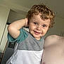 adult, arm, casual, child, curly_hair, cute, face, happy, home, human, indoor, kitchen, person, portrait, refrigerator, shirt, short_sleeves, skin, smile, toddler