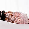 Ayla is registered to the contest to win money with this photo: child, toddler, girl, sleeping, lying_down, pink_dress, lace, bow, headband, dark_hair, barefoot, baby, portrait, studio, white_background, soft_lighting, peaceful, cute, infant, fashion