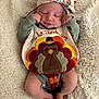 Macayla joined the competition — help win amazing prizes! baby, infant, sleeping, bib, thanksgiving, turkey, headband, floral, blanket, soft, cute, holiday, festive, clothing, person, newborn, peaceful, resting, legs, feet