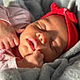 baby, sleeping, headband, red, blanket, soft, closeup, face, infant, peaceful, cozy, child, newborn, skin, hand, mouth, nose, eyelids, warmth, portrait