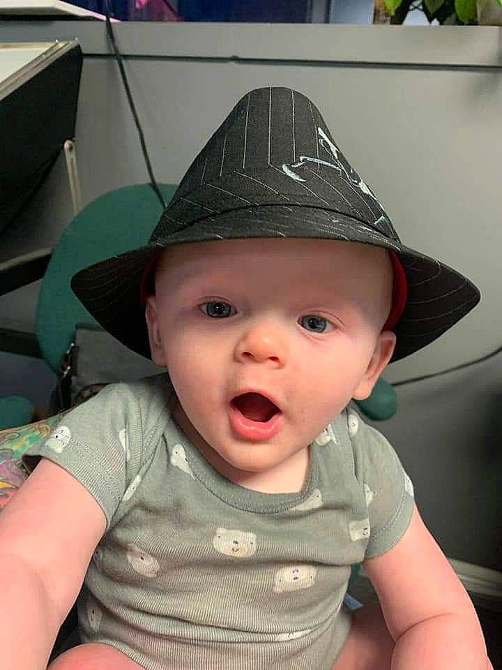 Lance is registered to the contest to win money with this photo: baby, cheek, child, fashion_accessory, hat, head, headgear, party_hat, person, skin, smile, sun_hat, surprise, toddler, vacation