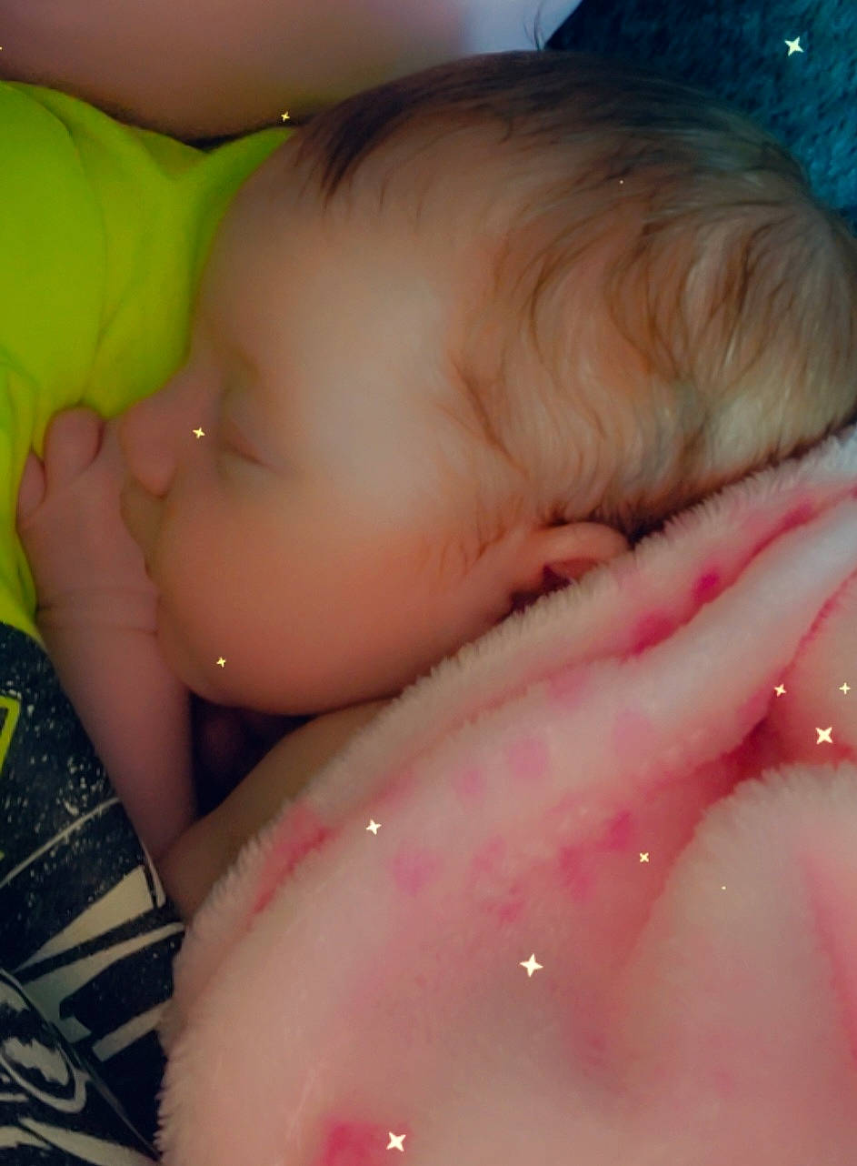 Harleigh is registered to the contest to win money with this photo: baby, cheek, ear, eyebrow, eyelash, finger, gesture, happy, head, human_body, iris, lip, mouth, nail, neck, nose, person, pink, skin, thumb