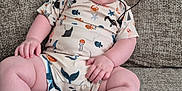 Arlo joined the competition — help win amazing prizes! baby, infant, child, smiling, hat, couch, clothing, patterned_outfit, sitting, indoors, cute, chubby_cheeks, face, feet, hand, comfortable, expression, portrait, texture, happy
