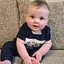 Arlo joined the competition — help win amazing prizes! baby, child, infant, couch, sofa, foot, hand, blue_clothing, curious_expression, indoor, cute, sitting, portrait, face, skin, hair, furniture, comfortable, playful, young