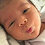 Keyhan is registered to the contest to win money with this photo: baby, face, closeup, expression, infant, skin, blanket, pout, mouth, eyes, newborn, cute, soft, sleepy, cheeks, head, person, clothing, indoors, wrapped