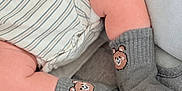 Keyhan joined the competition — help win amazing prizes! baby, bear_face, blanket, child, closeup, comfort, cozy, cute, feet, hand, infant, legs, onesie, resting, skin, socks, soft_texture, striped_clothing, toddler, warm