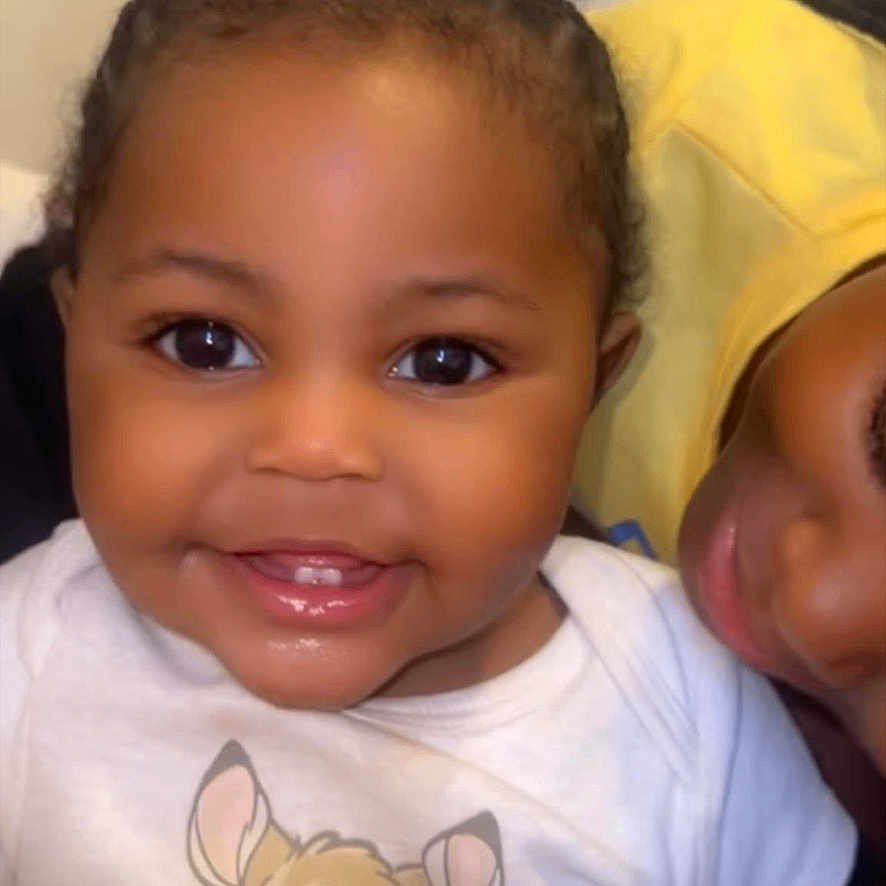 Kemora is registered to the contest to win money with this photo: baby, black_hair, cartoon, child, closeup, cute, deer, eyes, face, family, happy, indoor, infant, love, mouth, person, pigtails, shirt, skin, smiling