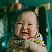 Benjamin joined the competition — help win amazing prizes! baby, child, smile, happy, face, infant, cute, indoor, clothing, animal_print, hand, person, portrait, cheeks, young, toddler, expression, skin, head, closeup