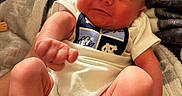 Cypress joined the competition — help win amazing prizes! newborn, baby, infant, sleeping, face, portrait, blanket, swaddle, onesie, clothing, baby_feet, socks, raised_fist, adult_hand, indoor, cozy, bed, soft_lighting, closeup, family