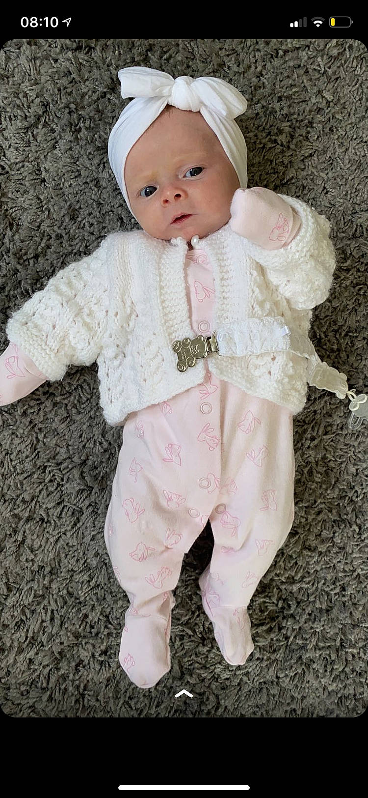 Jorgie is registered to the contest to win money with this photo: baby, baby_toddler_clothing, cap, cheek, doll, face, fur, head, headgear, human_body, iris, lip, pattern, peach, person, pink, skin, sleeve, toddler, white