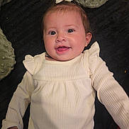 Anniliah joined the competition — help win amazing prizes! baby, blanket, bow, child, cushion, cute, expression, face, happy, head, indoors, infant, long_sleeves, lying_down, person, portrait, skin, smiling, white_clothing, young_child