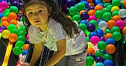 Aurora joined the competition — help win amazing prizes! activity, ball_pit, bright_colors, casual_clothing, child, colorful_balls, curly_hair, entertainment, fun, gray_pants, indoor_play_area, leisure, neon_lights, pigtails, play, playground, reflection, slide, white_shirt, young_child