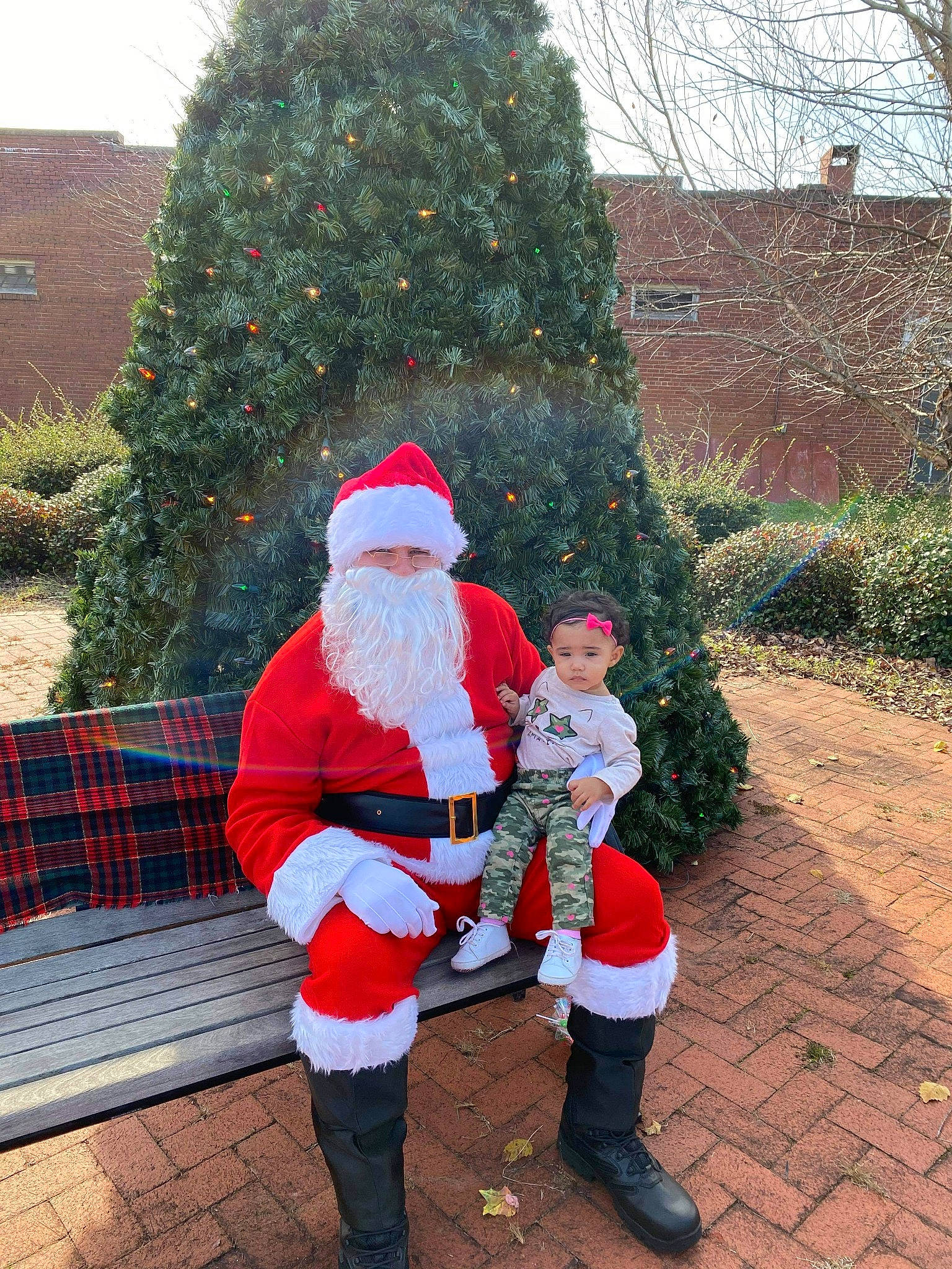 Dezrae is registered to the contest to win money with this photo: beard, boot, christmas, christmas_decoration, christmas_eve, christmas_tree, conifer, costume_accessory, costume_hat, event, facial_hair, fictional_character, fur, fur_clothing, holiday, lap, person, plaid, santa_claus, tradition