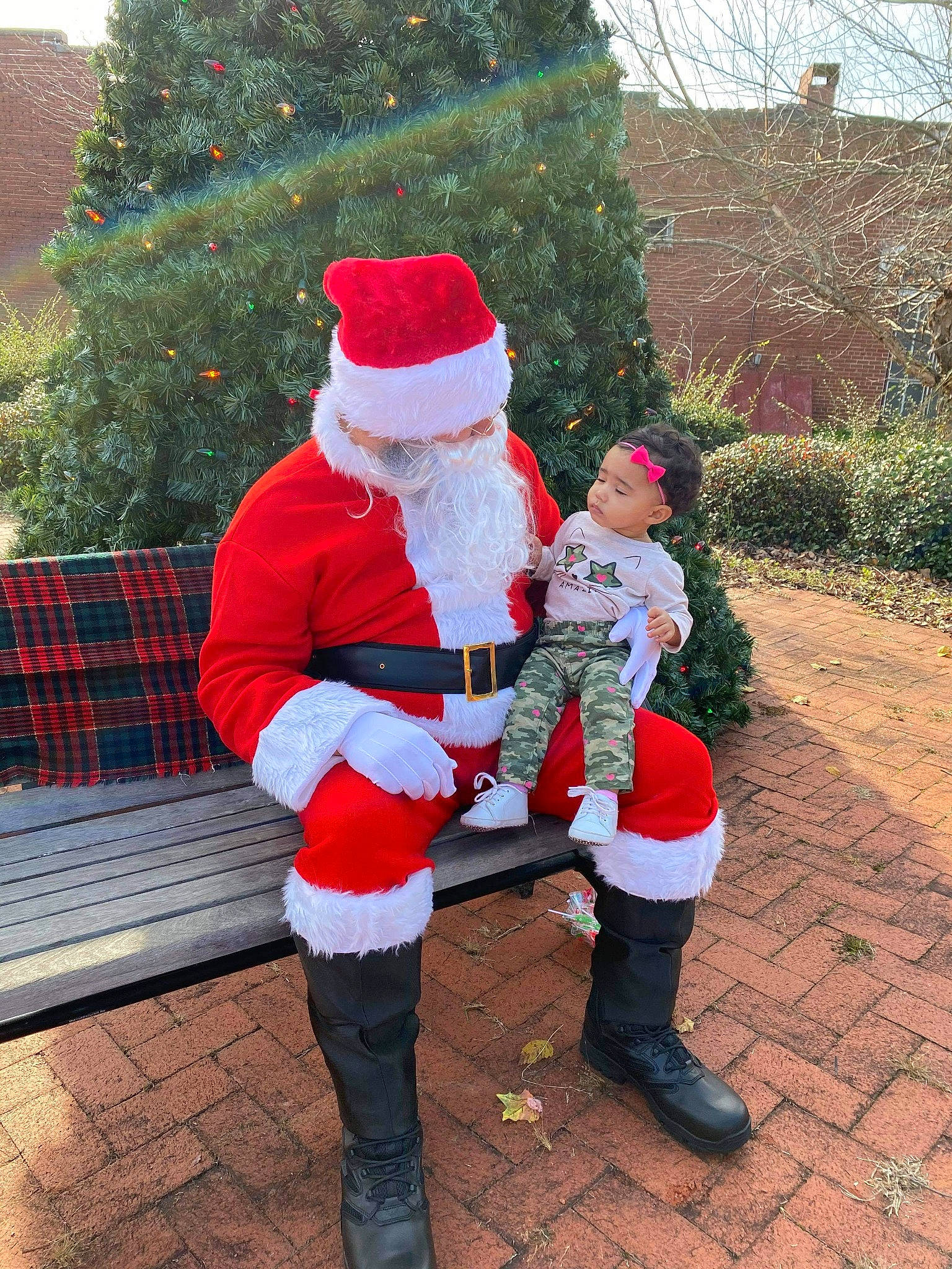 Dezrae is registered to the contest to win money with this photo: boot, christmas, christmas_decoration, christmas_eve, costume, costume_accessory, costume_hat, event, fictional_character, fur, fur_clothing, hat, holiday, lap, leg, person, red, riding_boot, santa_claus, textile
