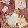 baby, infant, tutu, dress, headband, plush_toy, blanket, milestone_card, pink, white, cute, lying_down, soft_texture, floor, indoors, child, young, adorable, person, decor