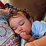 Zoë joined the competition — help win amazing prizes! toddler, child, sleeping, thumb_in_mouth, blanket, pillow, patterned_pillow, curly_hair, blue_shirt, couch, indoor, resting, peaceful, face, closed_eyes, comfort, cozy, young_child, relaxation, home