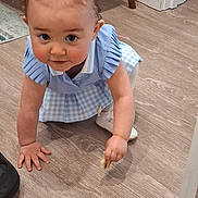 Zoë joined the competition — help win amazing prizes! baby, blue_dress, bow, child, crawling, curious, curly_hair, cute, flooring, hands, indoor, kneeling, person, playful, portrait, small_object, toddler, white_shoes, wooden_floor, young_child