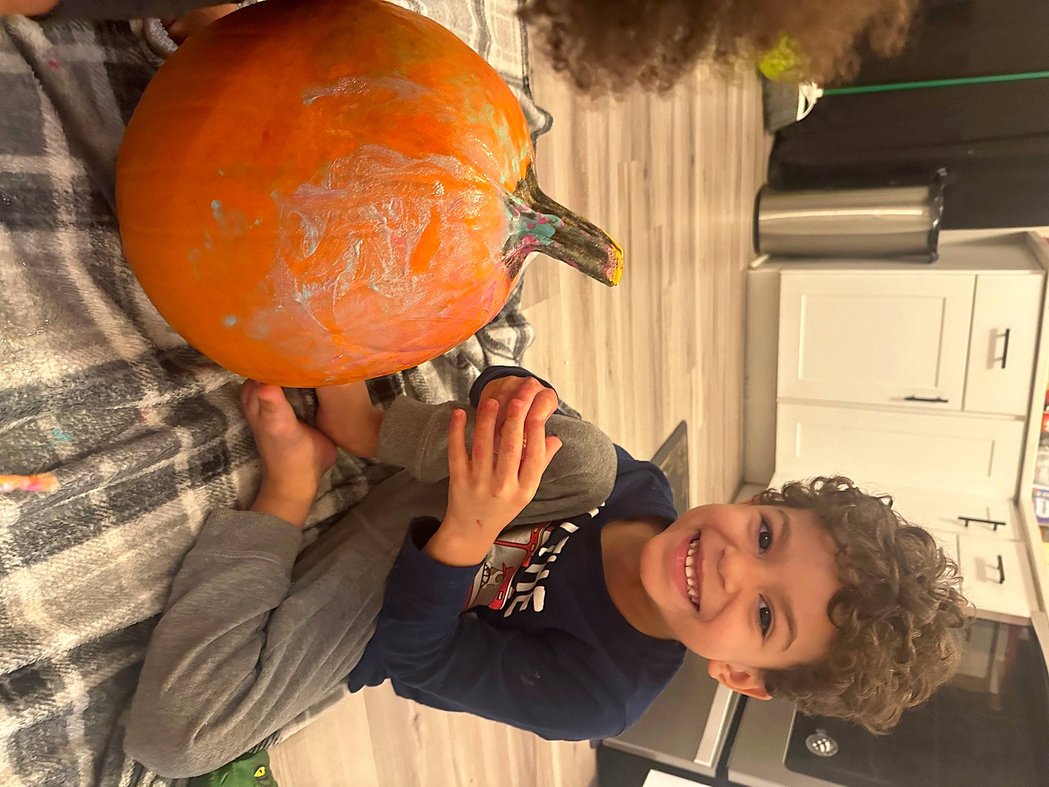 Kobe joined the competition — help win amazing prizes! cabinetry, calabaza, citrus, cucurbita, fruit, gourd, happy, joy, kitchen_appliance, local_food, natural_foods, orange, person, plant, produce, refrigerator, smile, squash, t_shirt, toddler