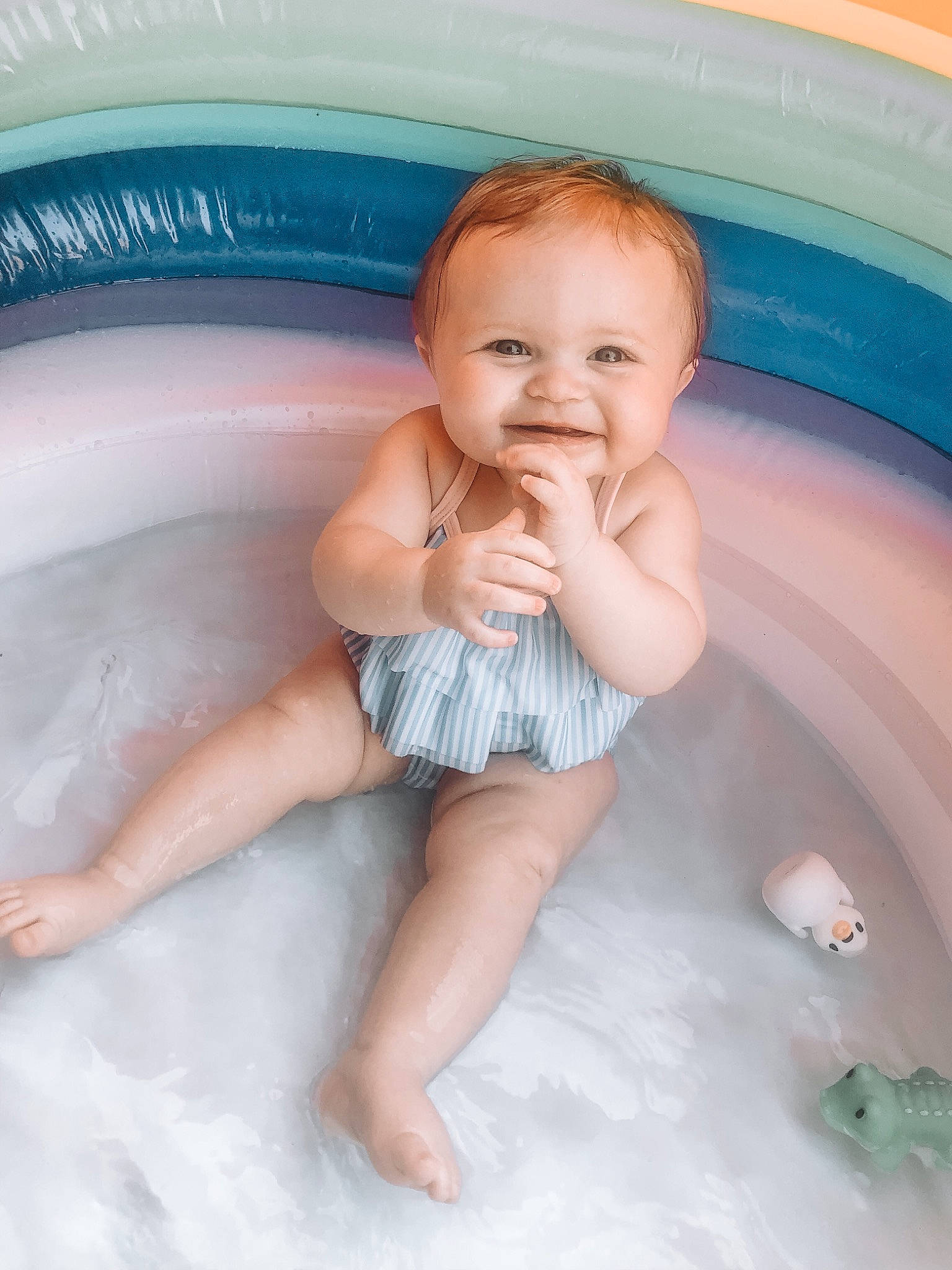 Adyson is registered to the contest to win money with this photo: arm, baby_bathing, bathing, blue, eye, face, facial_expression, finger, fluid, hand, happy, head, human_body, joy, person, pink, product, skin, smile, stomach