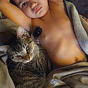 Johnathan joined the competition — help win amazing prizes! arm, bed, blanket, cat, child, cozy, cuddling, eyes, face, fur, home, pet, portrait, relaxed, shirtless, sleepy, tabby_cat, toddler, torso, whiskers