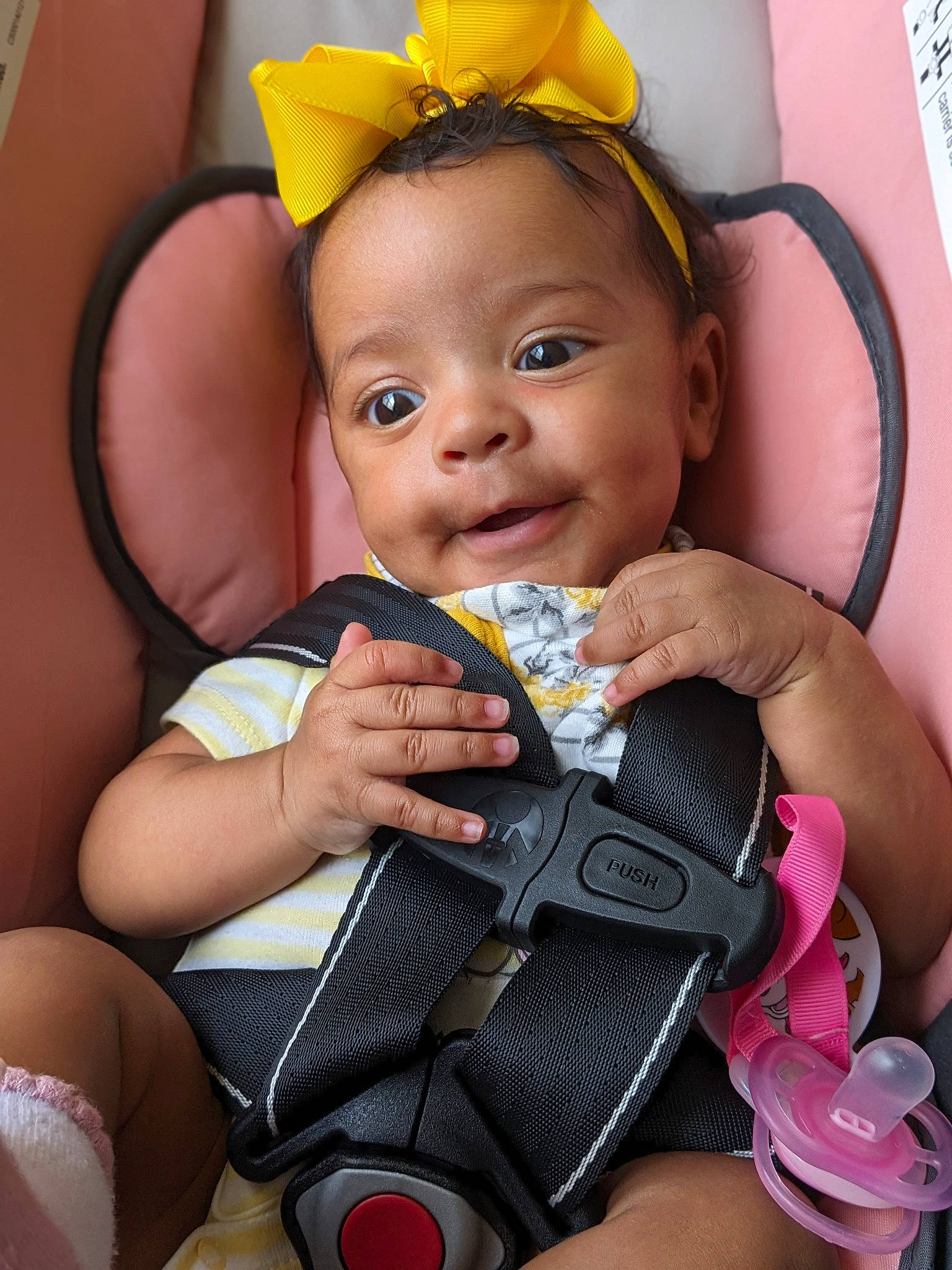 Hermione is registered to the contest to win money with this photo: baby, baby_toddler_clothing, cheek, child, eye, face, facial_expression, finger, fun, hairstyle, happy, head, iris, people, person, pink, product, skin, smile, toddler