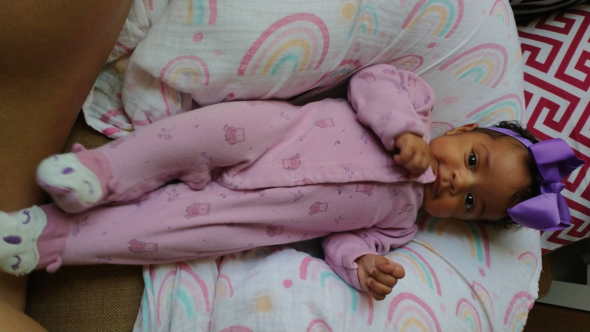 Hermione is registered to the contest to win money with this photo: baby, baby_products, baby_toddler_clothing, bed_sheet, bedding, bedtime, child, comfort, facial_expression, head, linens, magenta, nap, person, pink, room, skin, sleep, smile, textile