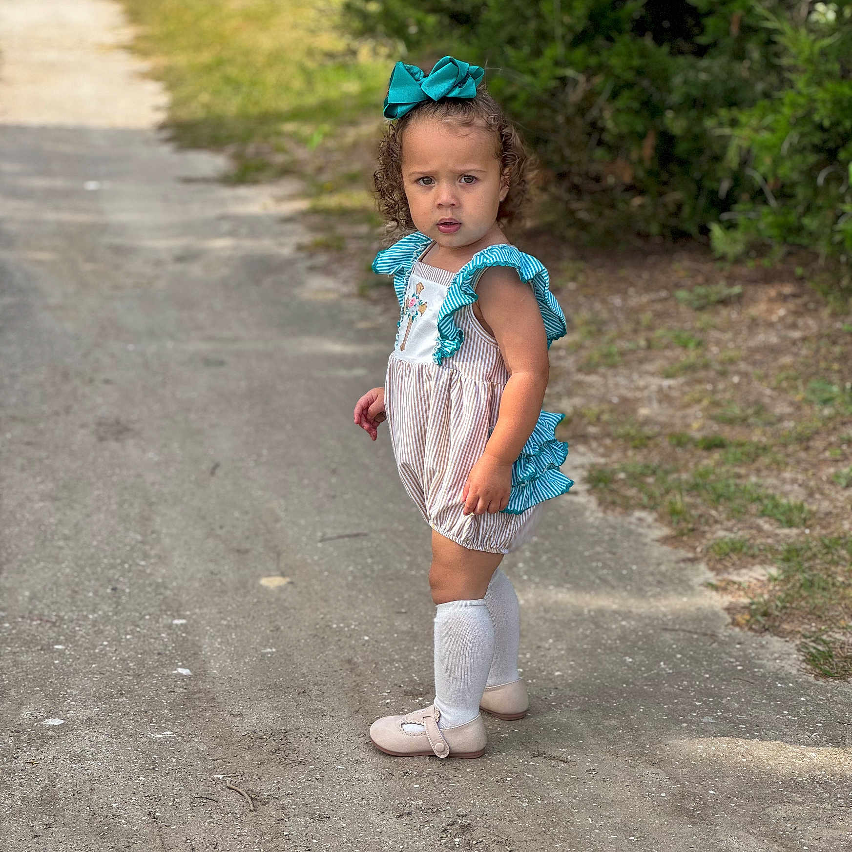 Palmer joined the competition — help win amazing prizes! child, city, clothing, dress, face, female, girl, hair, head, outdoors, person, photography, portrait, road, sitting, sleeve, standing, street, urban, walking