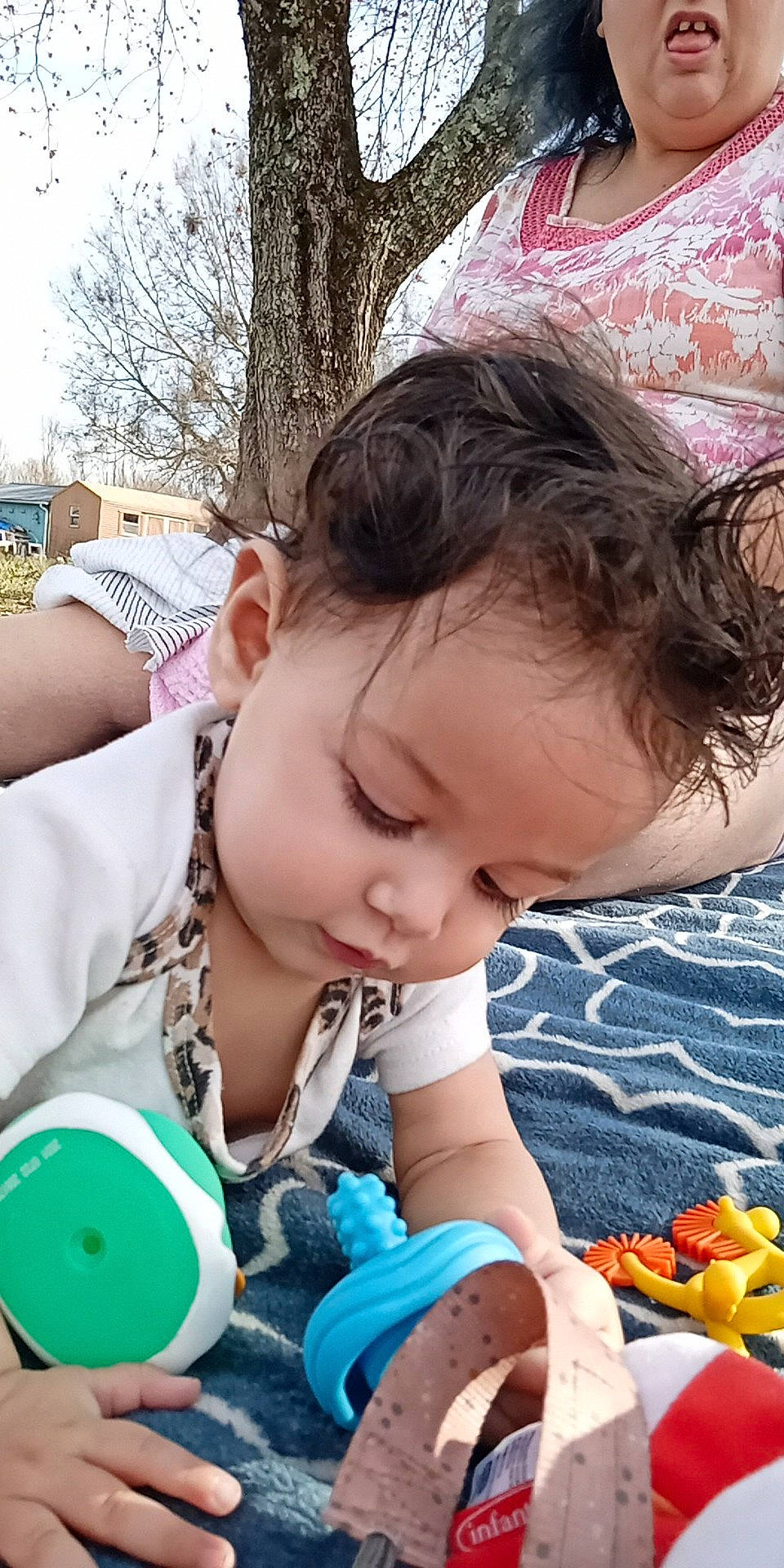 Emerald is registered to the contest to win money with this photo: baby, baby_toddler_clothing, child, facial_expression, fun, grass, green, happy, mouth, organ, people, person, photograph, pink, plant, product, skin, summer, toddler, tree