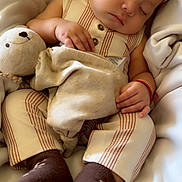 Sebastián joined the competition — help win amazing prizes! baby, sleeping, pajamas, teddy_bear, blanket, brown_socks, child, cute, cozy, rest, peaceful, indoor, soft_toys, infant, portrait, hands, face, comfort, relaxation, childhood