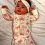 Miyla is registered to the contest to win money with this photo: baby, blanket, butterfly_pattern, child, cute, face, hand, headband, indoors, infant, lying_down, newborn, onesie, peaceful, pink, portrait, sleepwear, small_fingers, soft_texture, white