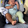 baby, sleeping, cast, car_seat, infant, child, diaper, clothing, blanket, foot, hand, face, peaceful, indoors, resting, cute, young, pale_blue, fabric, seat