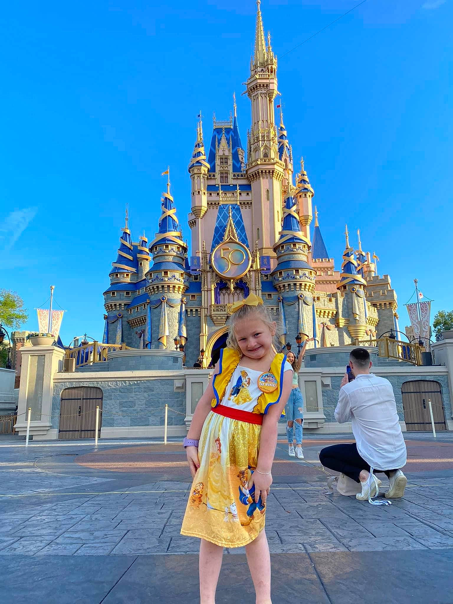 Lakelyn is registered to the contest to win money with this photo: amusement_park, city, event, facade, fun, happy, joy, landmark, leisure, nonbuilding_structure, person, place_of_worship, recreation, shorts, sky, smile, spire, temple, tourism, travel