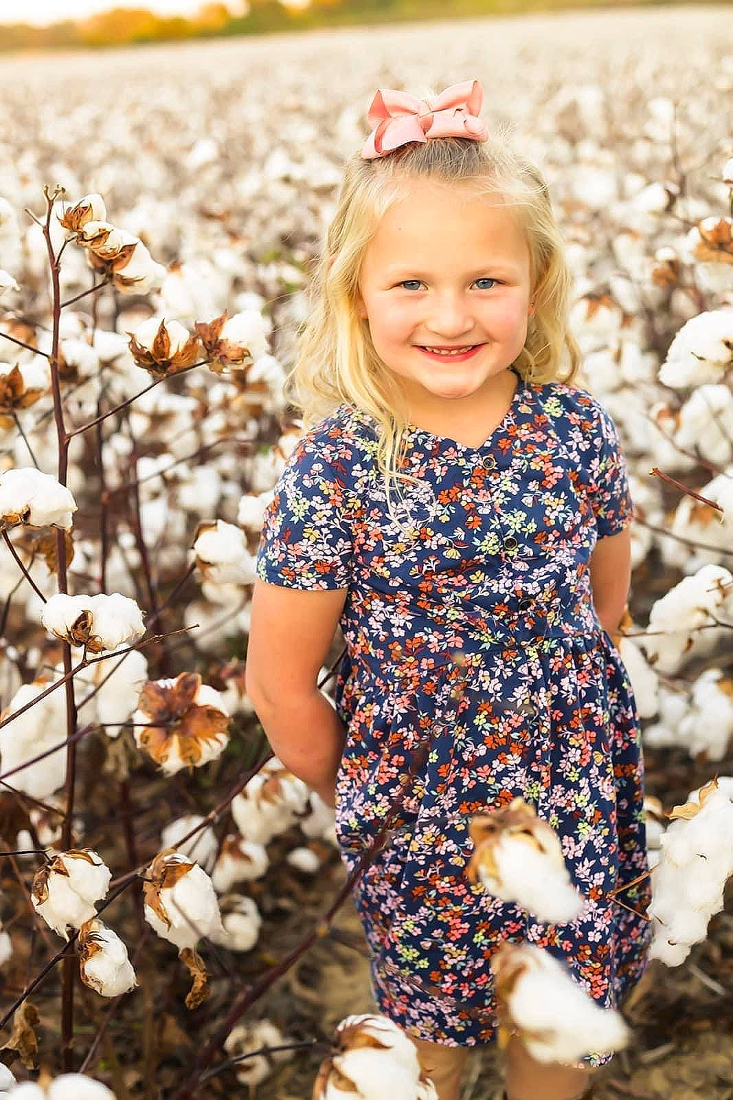 Lakelyn is registered to the contest to win money with this photo: baby_toddler_clothing, beauty, eye, facial_expression, grass, hair, hairstyle, happy, head, joy, leaf, organ, people_in_nature, person, photograph, plant, skin, sleeve, smile, t_shirt