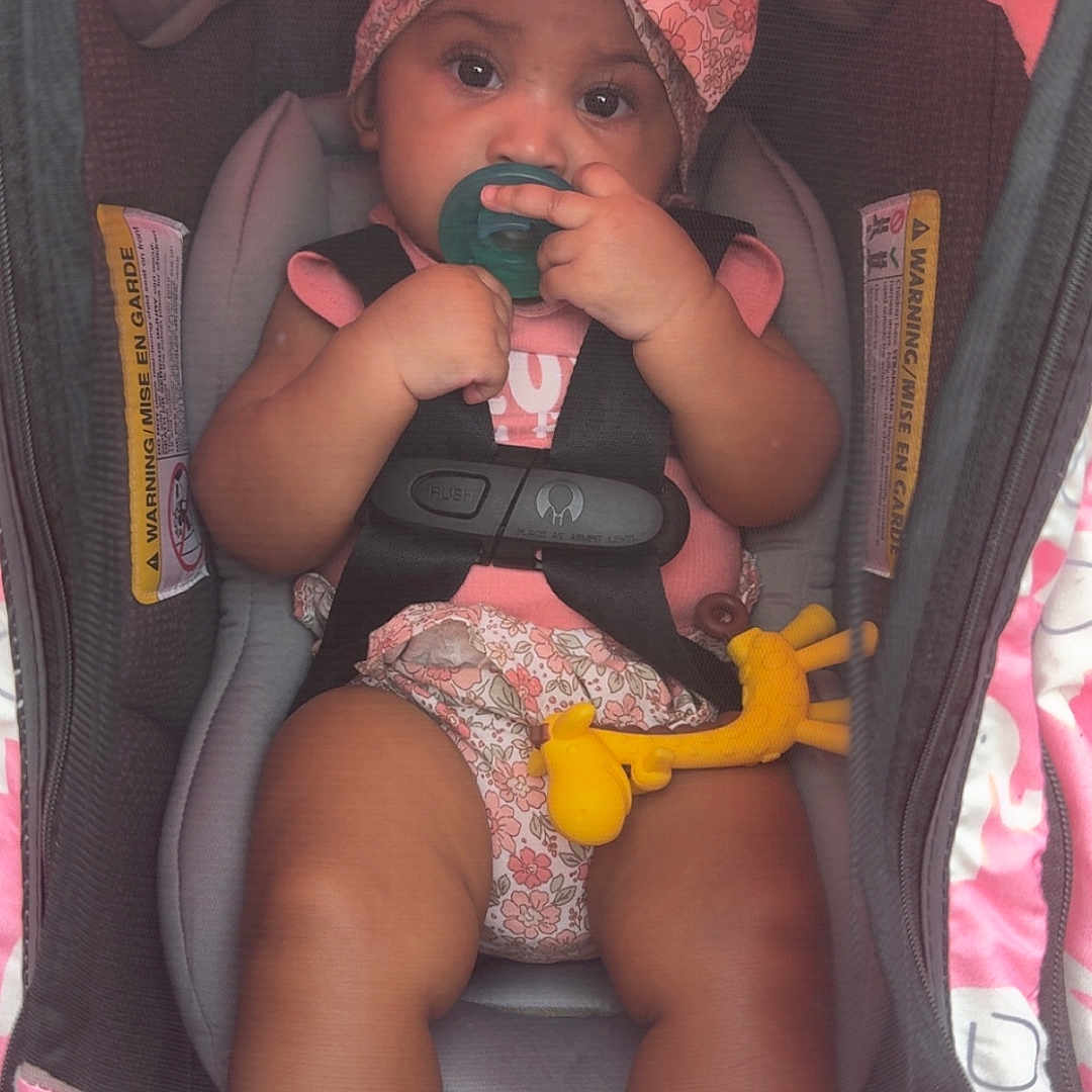 Keymoni joined the competition — help win amazing prizes! accessory, baby, car_seat, child, clothing, comfort, cute, elephant_pattern, floral_pattern, giraffe_toy, headband, indoors, infant, pacifier, pink, portrait, safety_harness, sitting, toy, young_child