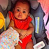 Keymoni is registered to the contest to win money with this photo: baby, blanket, car_seat, child, closeup, comfort, cute, earrings, expression, eyes, face, hands, indoor, infant, legs, patterned_blanket, pink_blanket, portrait, red_clothing, seated