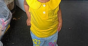 Keymoni joined the competition — help win amazing prizes! toddler, child, yellow_top, jeans, colorful_pants, indoor, floor, curious, looking_up, shoes, bow_shoes, earrings, standing, clothing, bags, hanging_clothes, door, black_floor, casual, portrait