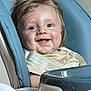 baby, child, high_chair, blue, smiling, happy, indoor, face, drool, hair, clothing, seat, person, infant, cute, young, portrait, sitting, feeding_chair, expression