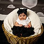 Reynesmae is registered to the contest to win money with this photo: baby, infant, basket, wicker, black_bow, headband, white_shirt, black_tutu, blanket, fluffy, heart_background, portrait, cute, child, sitting, adorable, indoor, soft_lighting, cozy, smiling