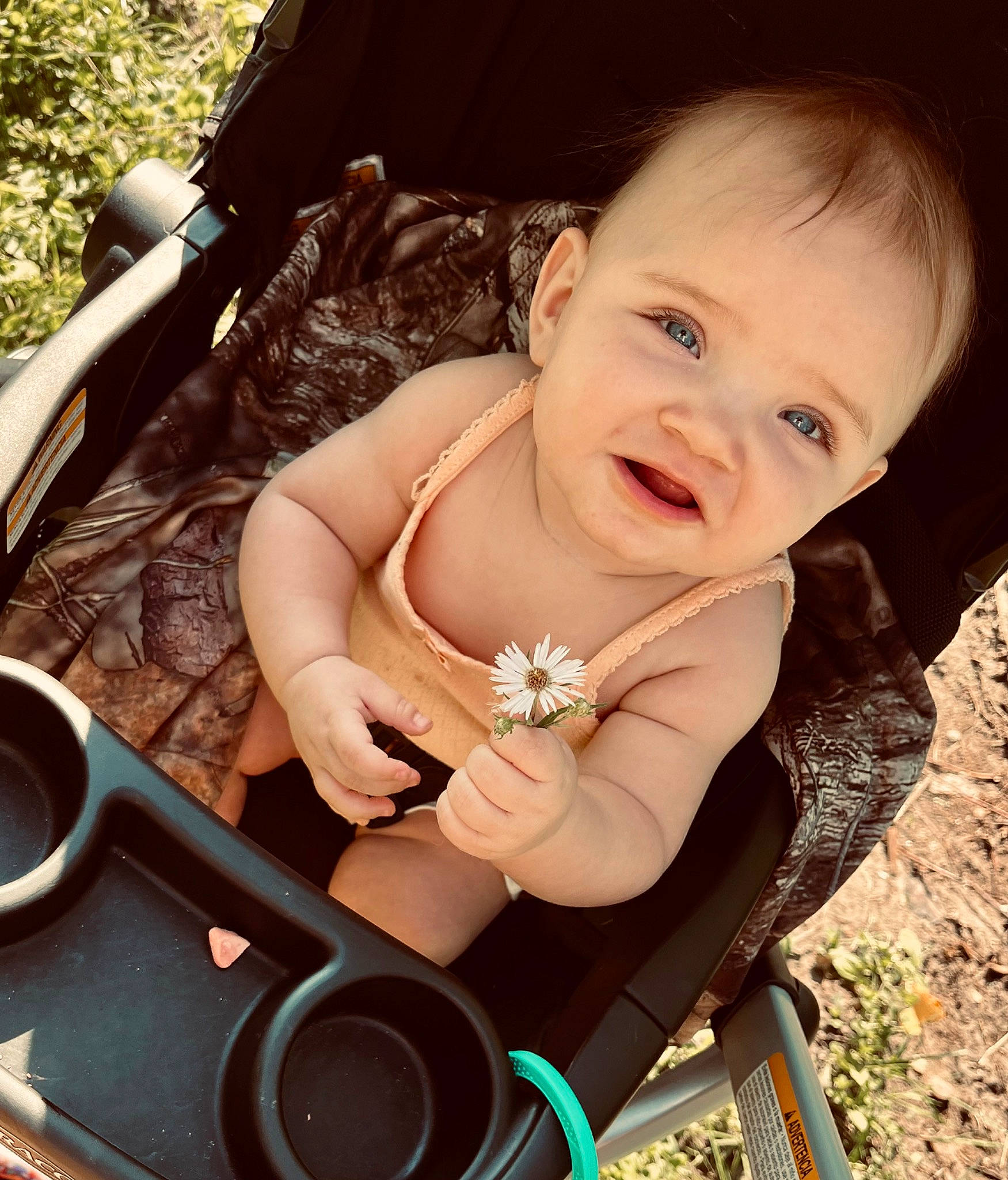 Maryjane is registered to the contest to win money with this photo: arm, baby, baby_carriage, baby_toddler_clothing, chair, cool, eyewear, finger, fun, grass, happy, leisure, lip, mouth, person, plant, skin, smile, swing, thumb
