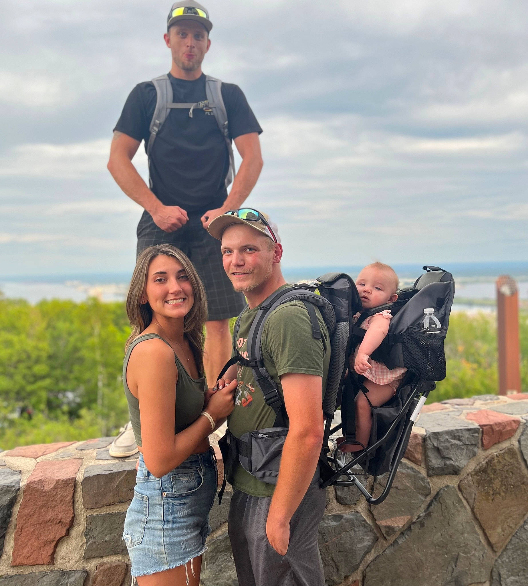 Maryjane is registered to the contest to win money with this photo: adventure, backpack, bag, baseball_cap, cloud, event, fun, happy, hat, headwear, joy, landscape, leisure, luggage_and_bags, people_in_nature, person, recreation, shorts, sky, smile