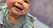 Marleigh joined the competition — help win amazing prizes! apparel, baby, child, close_up, cute, expression, face, happy, indoor, infant, lying_down, person, portrait, rosy_cheeks, short_hair, skin, smiling, soft_texture, toddler, young_child